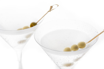 Classic Dry Martini with olives isolated on white background
