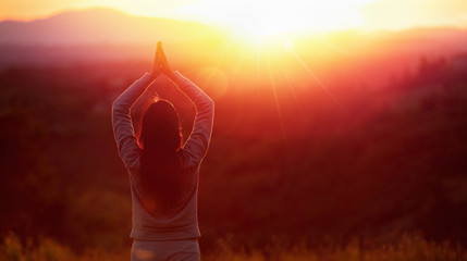 Yoga Woman Meditating At Sunset