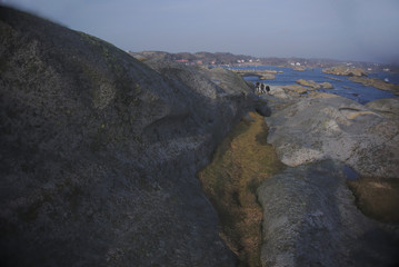 Fototapeta na wymiar climbing the rocks at Verdens Ende
