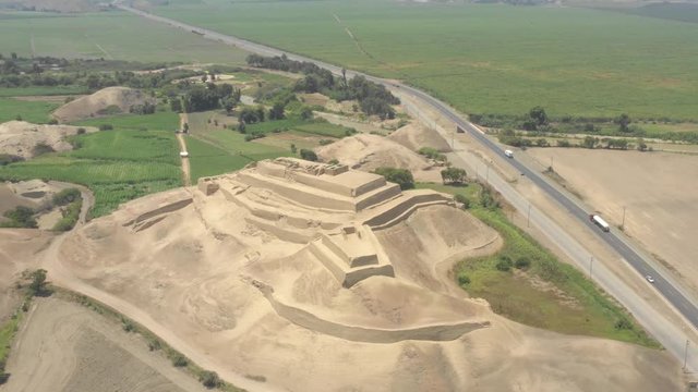 Pullback and tilt up of Paramonga prehispanic fortress, in Paramonga, Lima, Peru