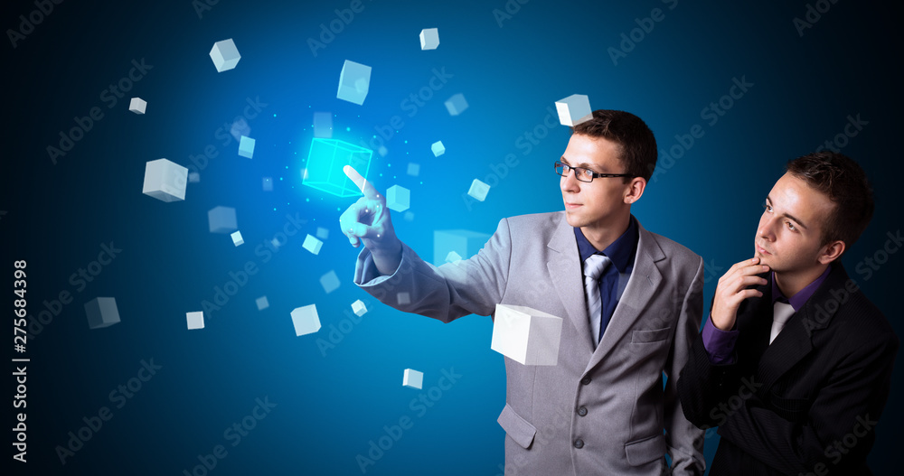 Poster Man touching hologram screen displaying cube symbols
