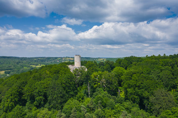 Aerial view of Lipowiec castle.. Historic castle Lipowiec and antique building museum. The ruins of the top of the mountain. Summer time.