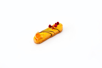 Chocolate eclair with fruit decor isolate on white background