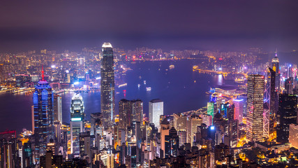 High view of Hong Kong skyline cityscape night light over Victoria harbour at Victoria Peak