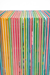Stack of colorful books close up.