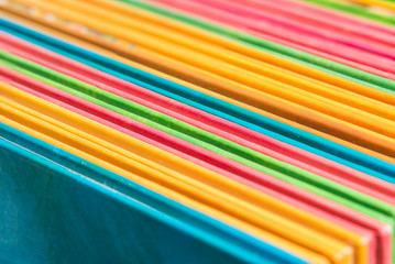 Stack of colorful books close up.