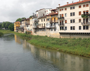 Fototapeta premium River and the houses in Vicenza City in italy seen from Angels B