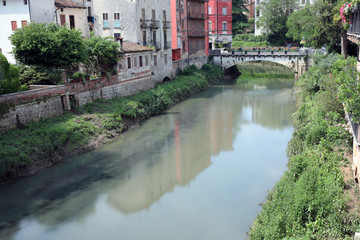 Fototapeta na wymiar Retrone river in Vicenza City in Italy and the Saint Paul Bridge