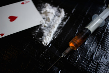 Drug abuse dangerous drugs cocaine heroin heroine addiction concept black background 