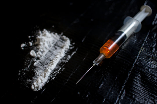 Drug abuse dangerous drugs cocaine heroin heroine addiction concept black background 