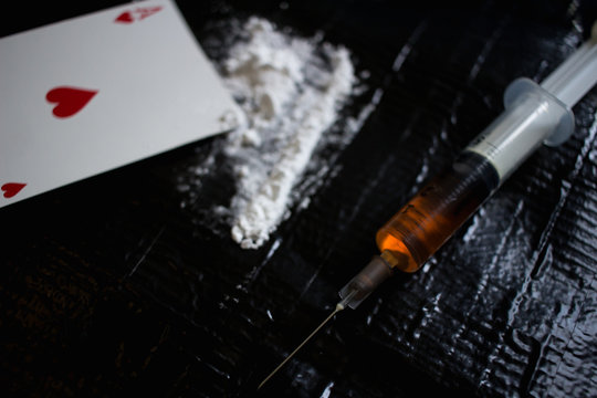 Drug abuse dangerous drugs cocaine heroin heroine addiction concept black background 