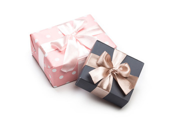 Luxury boxes tied with a pink and gold ribbon.