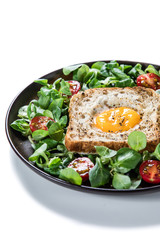 Breakfast - toasted bread with fried egg and vegetables