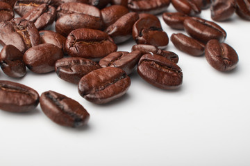 aromatic roasted coffee beans on white background