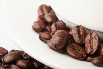 aromatic roasted coffee beans on white background