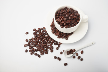 aromatic roasted coffee beans on white background