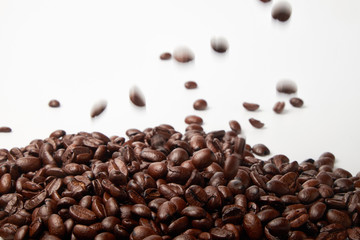 aromatic roasted coffee beans on white background