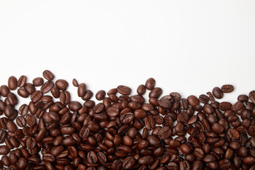 aromatic roasted coffee beans on white background