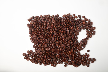 aromatic roasted coffee beans on white background