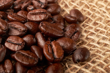 aromatic roasted coffee beans on white background