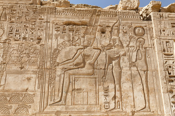 Fototapeta na wymiar Egyptian Hieroglyphs in Medinet Habu Temple, Luxor, Egypt