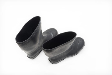 Black rubber boots isolated on white background.