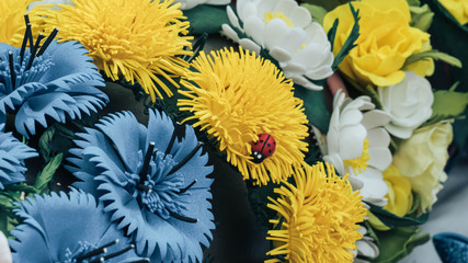 texture - yellow, white and blue decorative flowers