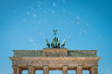 Brandenburg Gate / Brandenburger Tor on sunny day with blue sky and soap bubbles