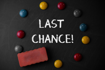 Word writing text Last Chance. Business photo showcasing final opportunity to achieve or acquire something you want Round Flat shape stones with one eraser stick to old chalk black board