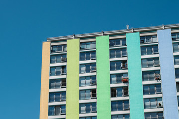 Fototapeta premium colorful residential building facade, apartment house / real estate exterior -