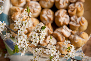 Homemade biscuit with violet hyacinth, white flower and yellow taraxacum on the wooden table