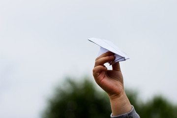 hand with paper plane