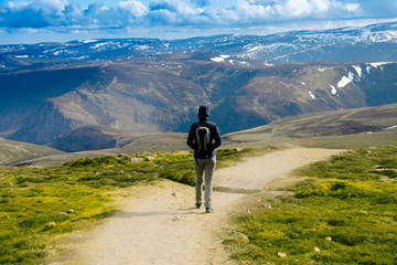 Tourist walking in Cairngorm Mountains. Angus, Scotland, United Kingdom