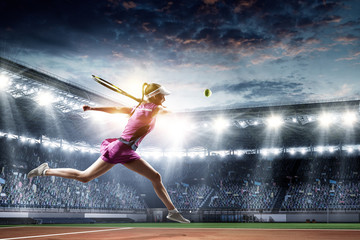 Young woman playing tennis in action. Mixed media