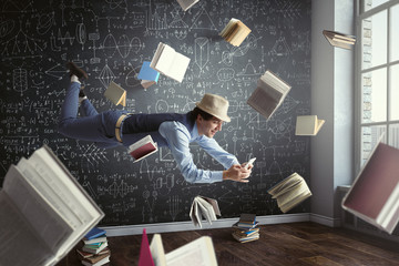 Smiling joyful levitating young man. Mixed media