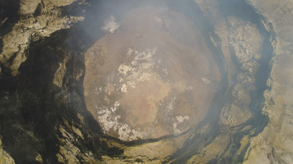 smoking crater active volcano Bromo. aerial view mountain landscape volcano crater and mountains Tengger Semeru national park Java, Indonesia.