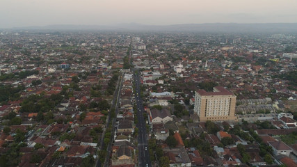 Obraz premium aerial view yogyakarta city cultural capital indonesia located on java island. Yogyakarta with buildings, highway at sunset time. aerial view