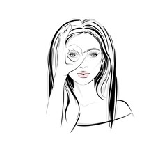 Beautifull woman with long dark hair, with crossed her fingers and looks like through binoculars