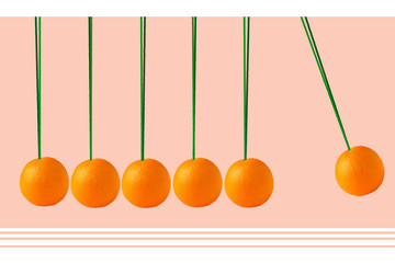 Oranges hanging in the form of Newton's pendulum.