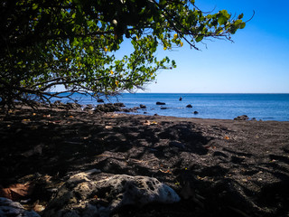 Tropical Fishing Rocky Beach Scenery Under The Tree In The Dry Season At The Village, Umeanyar, North Bali, Indonesia
