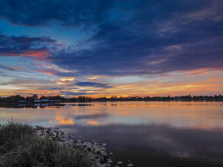 Lake view morning scenic above lotus lake with cloudy sky background, sunrise at Krajub Reservoir, Ban Pong, Ratchaburi, Thailand.