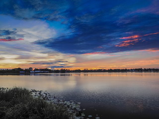 Lake view morning scenic above lotus lake with cloudy sky background, sunrise at Krajub Reservoir, Ban Pong, Ratchaburi, Thailand.