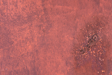 Rusty metal texture with scratches and cracks. paint traces. Red colors. Copy space