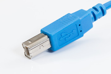 Blue USB cable on a white background. - 275708585