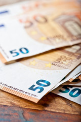 Pile of fifty euro banknotes.