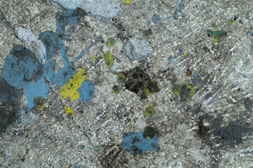  Abstraction. Concrete background with blue and yellow paint stains.