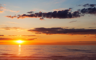 Fototapeta premium Sunset at sea in summer