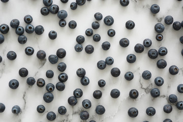 Top view blueberries antioxidant superfood on white marble background