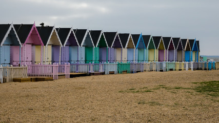 Beach Huts in England after a storm in West Mersea, England UK