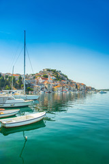 The old town of Sibenik on the Adriatic coast in Dalmatia, Croatia, famous tourist destination, boats in harbour